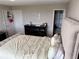 Comfortable bedroom with a large bed, dark dresser and closet for storage at 2479 Peachtree Ne Rd # 1714, Atlanta, GA 30305