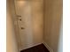 A simple white door with a dark handle and peephole stands between neutral colored walls at 2479 Peachtree Ne Rd # 1714, Atlanta, GA 30305