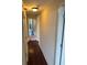 Hallway with hardwood floors, white doors, and a mirror at 2479 Peachtree Ne Rd # 1714, Atlanta, GA 30305