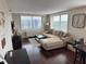 Inviting living area with sectional sofa and expansive windows offering beautiful city views at 2479 Peachtree Ne Rd # 1714, Atlanta, GA 30305