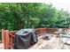 Outdoor deck features grill, seating and a fire pit for backyard relaxation at 2693 Blairsden Nw Pl, Kennesaw, GA 30144
