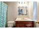 Cozy bathroom featuring vanity with a decorative mirror and patterned shower curtain at 2693 Blairsden Nw Pl, Kennesaw, GA 30144