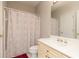 Bathroom with a sink, toilet and patterned shower curtain at 2693 Blairsden Nw Pl, Kennesaw, GA 30144