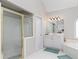 Bathroom featuring a glass-enclosed shower, tub, white cabinetry, and tile flooring at 2693 Blairsden Nw Pl, Kennesaw, GA 30144