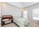 Bright bedroom featuring a vaulted ceiling, recessed lights, and two windows with blinds at 2693 Blairsden Nw Pl, Kennesaw, GA 30144