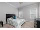 Cozy bedroom with neutral paint, carpet flooring, and a ceiling fan at 2693 Blairsden Nw Pl, Kennesaw, GA 30144