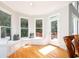Bright breakfast nook with a bay window, built-in seating and storage, and hardwood flooring at 2693 Blairsden Nw Pl, Kennesaw, GA 30144