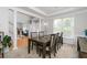 Elegant dining room featuring tray ceilings and lots of light from the large windows at 2693 Blairsden Nw Pl, Kennesaw, GA 30144