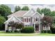 Charming two-story home with stone accents, red shutters, and lush landscaping at 2693 Blairsden Nw Pl, Kennesaw, GA 30144