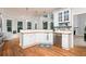 Clean kitchen featuring white cabinets, stainless steel appliances, and hardwood floors at 2693 Blairsden Nw Pl, Kennesaw, GA 30144