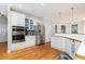 Bright eat-in kitchen with stainless steel appliances and white cabinetry at 2693 Blairsden Nw Pl, Kennesaw, GA 30144