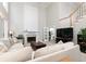 Spacious living room with high ceilings, fireplace, and staircase at 2693 Blairsden Nw Pl, Kennesaw, GA 30144