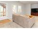Living room with a view to the back deck, large windows, and neutral carpeting at 2693 Blairsden Nw Pl, Kennesaw, GA 30144