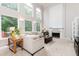 Bright living room with tall ceilings, many windows and fireplace at 2693 Blairsden Nw Pl, Kennesaw, GA 30144