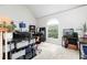 Bright office space with a vaulted ceiling and a large window overlooking the backyard at 2693 Blairsden Nw Pl, Kennesaw, GA 30144