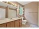 Well-lit bathroom includes a spacious vanity, patterned walls, and shower with tub at 4313 Deep Springs Nw Ct, Kennesaw, GA 30144