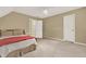 Neutral bedroom with neutral carpet, ceiling fan, and adjacent bathroom for convenience at 4313 Deep Springs Nw Ct, Kennesaw, GA 30144