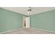 Airy green bedroom provides neutral carpet, ample space, and a ceiling fan for comfort at 4313 Deep Springs Nw Ct, Kennesaw, GA 30144