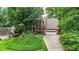 Charming two-story brick home with lush landscaping and a long driveway at 4313 Deep Springs Nw Ct, Kennesaw, GA 30144
