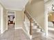 Welcoming foyer featuring tile flooring and a staircase with a wooden banister at 4313 Deep Springs Nw Ct, Kennesaw, GA 30144