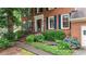 Inviting brick home featuring a manicured front yard with beautiful hydrangea bushes at 4313 Deep Springs Nw Ct, Kennesaw, GA 30144