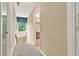 Hallway with natural light and adjacent bathroom, all neutral colored and well-lit at 4313 Deep Springs Nw Ct, Kennesaw, GA 30144