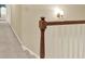 Hallway with wood railing and overhead lighting at 4313 Deep Springs Nw Ct, Kennesaw, GA 30144