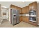 Updated kitchen boasts stainless steel appliances, ample cabinet space, and access to laundry at 4313 Deep Springs Nw Ct, Kennesaw, GA 30144
