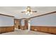 Large living room with wood paneling and views of other rooms at 4313 Deep Springs Nw Ct, Kennesaw, GA 30144