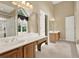 Main bathroom featuring dual vanities, soaking tub, and glass-enclosed shower at 4313 Deep Springs Nw Ct, Kennesaw, GA 30144