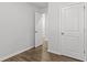 Bedroom featuring a double door, hard wood floors, and neutral walls at 7238 Crestside Dr, Austell, GA 30168