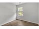 Bedroom with hardwood floors, natural light, and a neutral color scheme at 7238 Crestside Dr, Austell, GA 30168