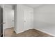 Cozy bedroom featuring a double door and hard wood floors at 7238 Crestside Dr, Austell, GA 30168