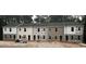 Row of newly constructed townhomes with modern design and varying color schemes at 7238 Crestside Dr, Austell, GA 30168