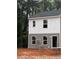 Two-story home with gray and white siding and dark roof at 7238 Crestside Dr, Austell, GA 30168