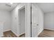 Hallway featuring hardwood floors and white painted walls at 7238 Crestside Dr, Austell, GA 30168