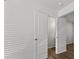Clean hallway with wood floor and interior door at 7238 Crestside Dr, Austell, GA 30168