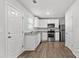 Modern kitchen with white cabinets, stainless steel appliances, and granite countertops at 7238 Crestside Dr, Austell, GA 30168
