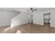 Spacious living room with hardwood flooring and access to kitchen and staircase at 7238 Crestside Dr, Austell, GA 30168