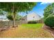 Expansive backyard featuring a well-kept lawn and a wooden fence, providing a private outdoor space at 910 Laurel Cove Dr, Snellville, GA 30078