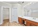 Bathroom has a double vanity, shower, and walk-in closet at 910 Laurel Cove Dr, Snellville, GA 30078