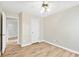 Inviting bedroom with a ceiling fan, two doors and hardwood floors, perfect for relaxation and rest at 910 Laurel Cove Dr, Snellville, GA 30078