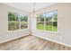Cozy breakfast nook with abundant natural light from the large windows overlooking the backyard at 910 Laurel Cove Dr, Snellville, GA 30078