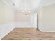 Elegant dining area with tray ceilings, new floors, and stylish wainscoting at 910 Laurel Cove Dr, Snellville, GA 30078