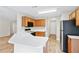 Open kitchen features a breakfast bar, plenty of counter space, and wood look floors at 910 Laurel Cove Dr, Snellville, GA 30078