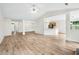 Expansive living area featuring hardwood floors and an open layout to the kitchen and dining space at 910 Laurel Cove Dr, Snellville, GA 30078