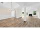 Spacious living room featuring new floors, a fireplace, and ample natural light at 910 Laurel Cove Dr, Snellville, GA 30078