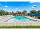 A large community pool with clear, blue water and plenty of seating for relaxing poolside at 910 Laurel Cove Dr, Snellville, GA 30078