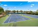 Well-maintained tennis courts with ample lighting and seating, perfect for recreational play at 910 Laurel Cove Dr, Snellville, GA 30078
