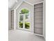 Bright bedroom with built-in bookshelves and a large window at 115 Graystone Terrace Ter, Alpharetta, GA 30005